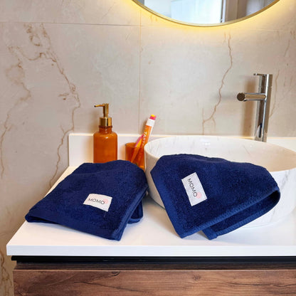 Blue bamboo washcloth in mood shot – soft, absorbent and sustainable